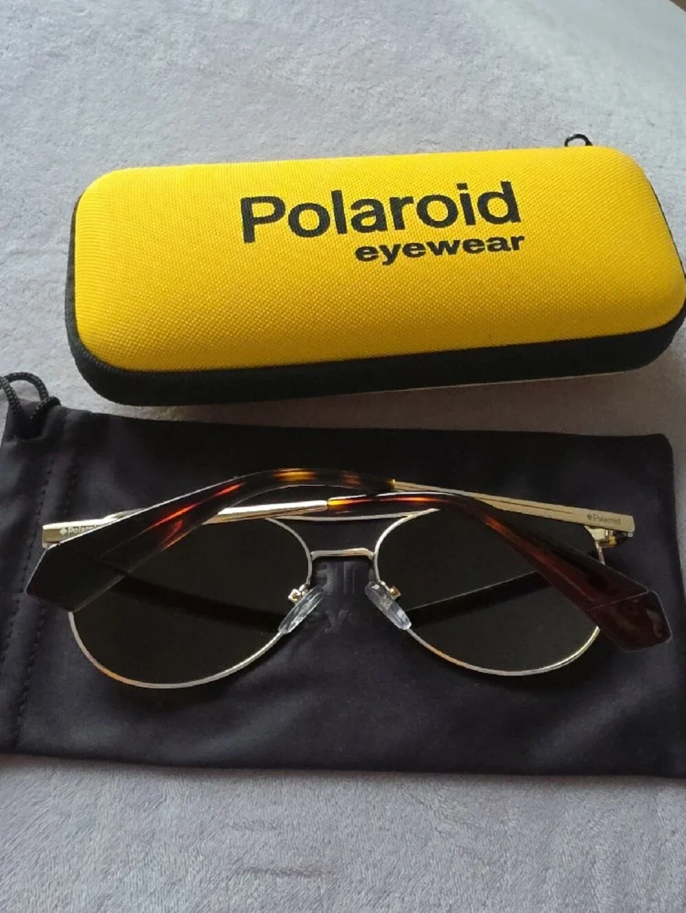 Polaroid Gold Frame Sunglasses with Yellow Case